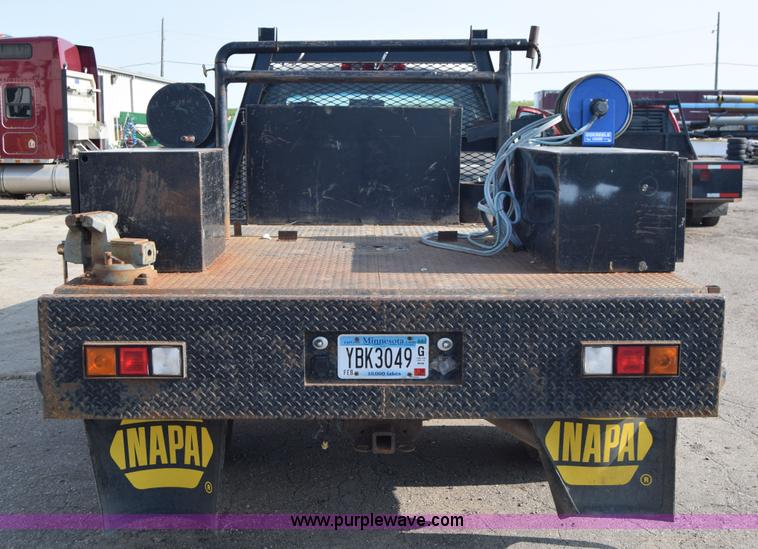 image for item L2579 2004 Dodge Ram 3500 Quad Cab flatbed pickup truck