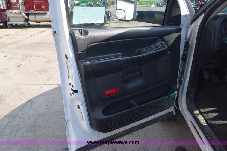 image for item L2579 2004 Dodge Ram 3500 Quad Cab flatbed pickup truck