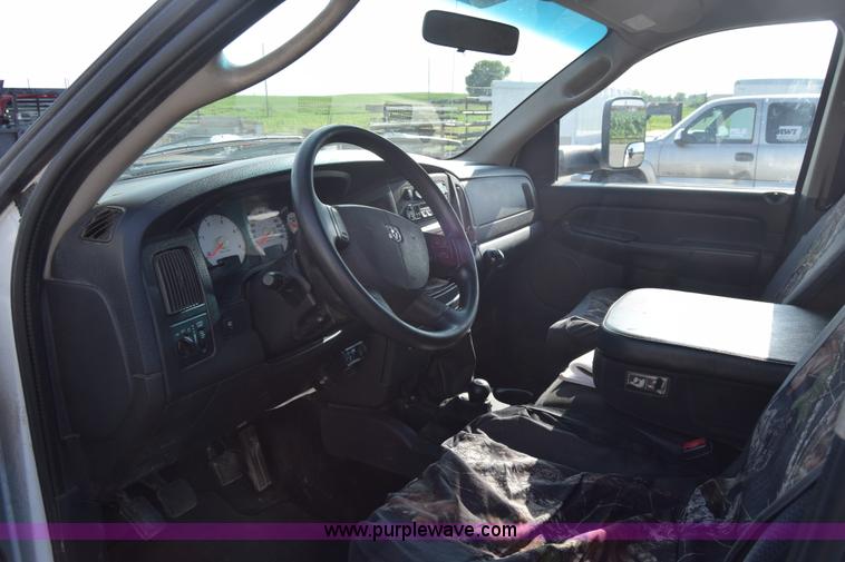 image for item L2579 2004 Dodge Ram 3500 Quad Cab flatbed pickup truck