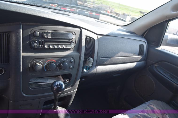 image for item L2579 2004 Dodge Ram 3500 Quad Cab flatbed pickup truck