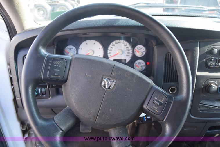 image for item L2579 2004 Dodge Ram 3500 Quad Cab flatbed pickup truck