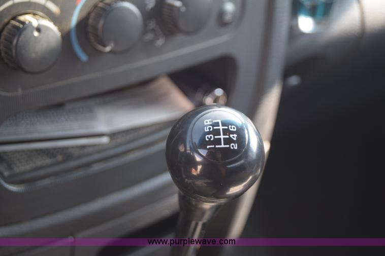 image for item L2579 2004 Dodge Ram 3500 Quad Cab flatbed pickup truck