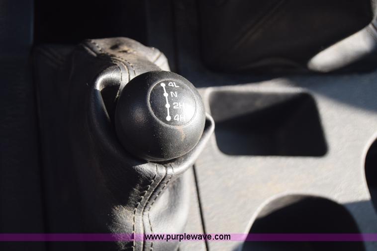 image for item L2579 2004 Dodge Ram 3500 Quad Cab flatbed pickup truck