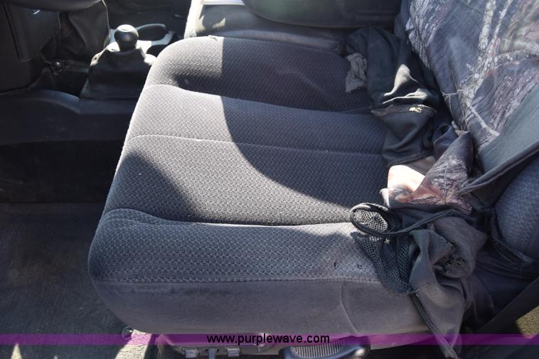 image for item L2579 2004 Dodge Ram 3500 Quad Cab flatbed pickup truck