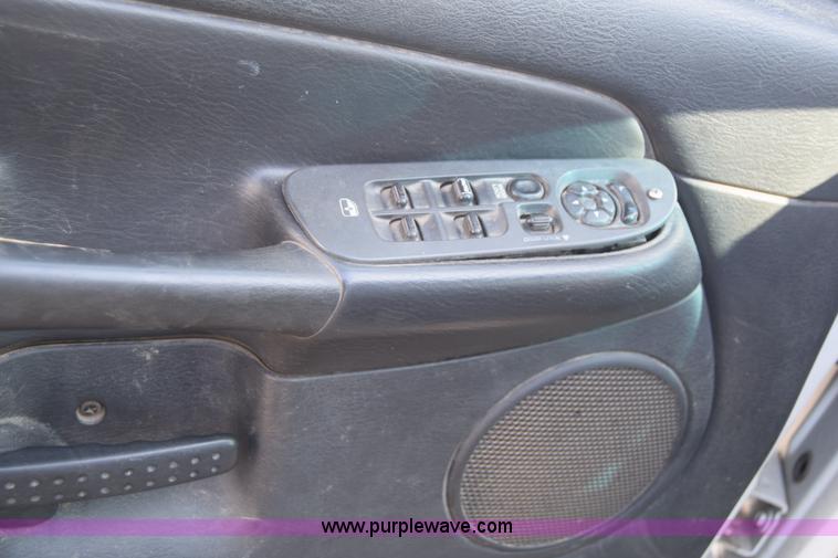 image for item L2579 2004 Dodge Ram 3500 Quad Cab flatbed pickup truck