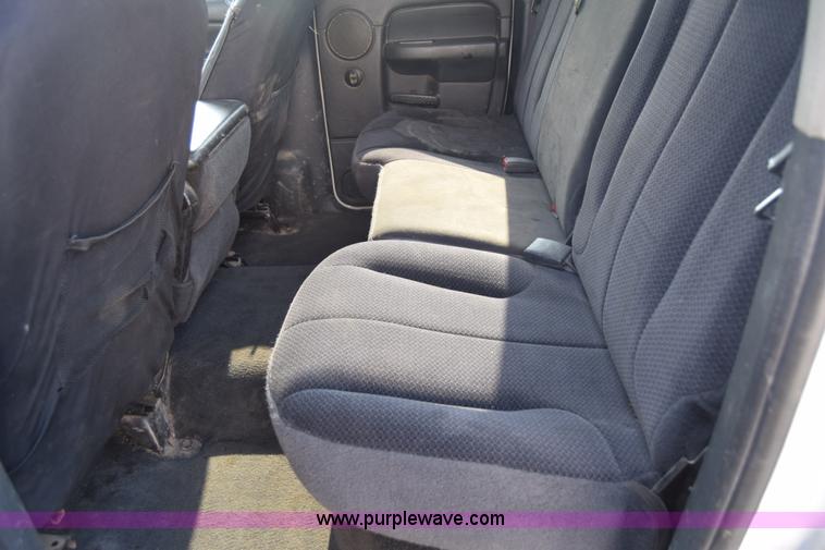 image for item L2579 2004 Dodge Ram 3500 Quad Cab flatbed pickup truck