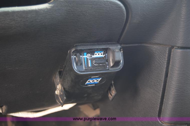 image for item L2579 2004 Dodge Ram 3500 Quad Cab flatbed pickup truck