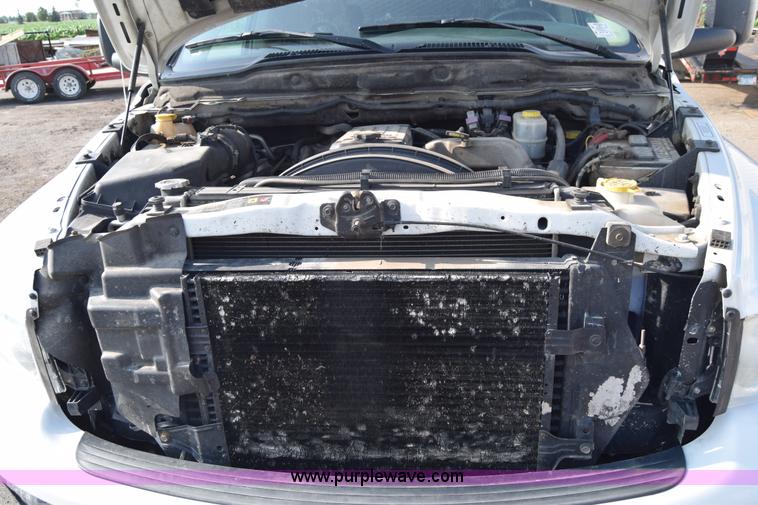 image for item L2579 2004 Dodge Ram 3500 Quad Cab flatbed pickup truck