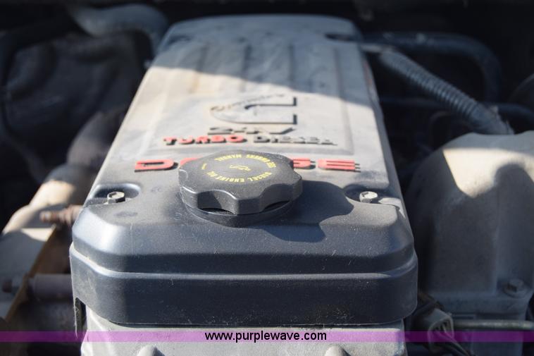 image for item L2579 2004 Dodge Ram 3500 Quad Cab flatbed pickup truck