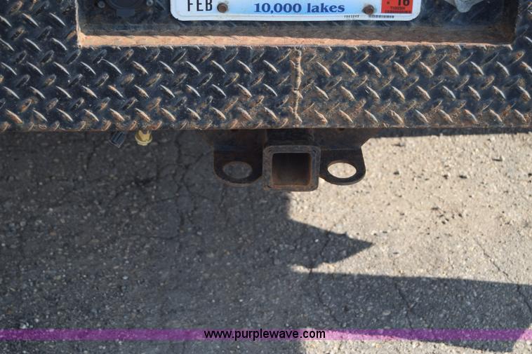 image for item L2579 2004 Dodge Ram 3500 Quad Cab flatbed pickup truck