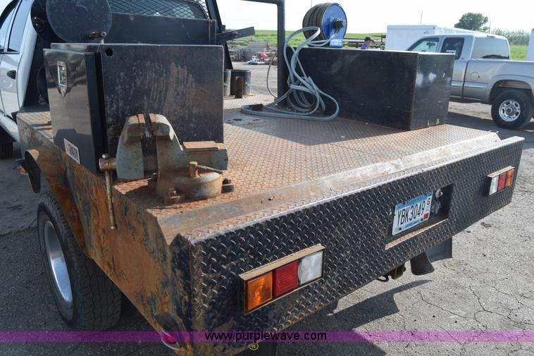 image for item L2579 2004 Dodge Ram 3500 Quad Cab flatbed pickup truck