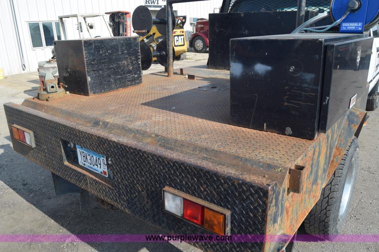 image for item L2579 2004 Dodge Ram 3500 Quad Cab flatbed pickup truck