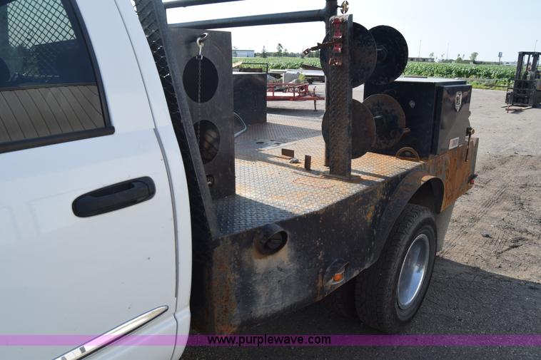 image for item L2579 2004 Dodge Ram 3500 Quad Cab flatbed pickup truck