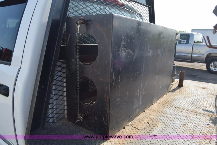 image for item L2579 2004 Dodge Ram 3500 Quad Cab flatbed pickup truck