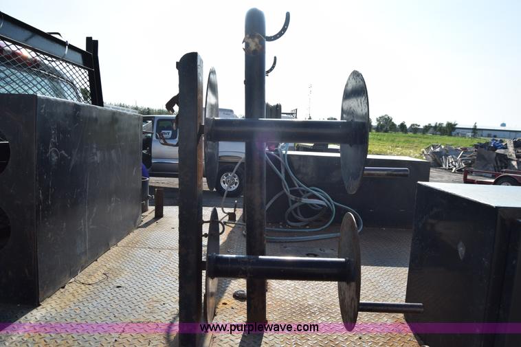 image for item L2579 2004 Dodge Ram 3500 Quad Cab flatbed pickup truck