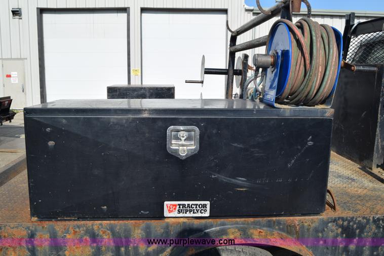 image for item L2579 2004 Dodge Ram 3500 Quad Cab flatbed pickup truck