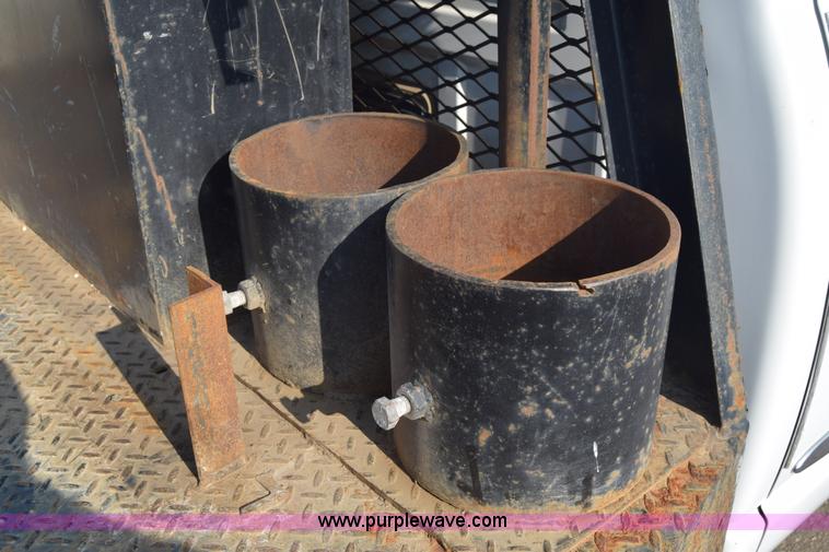 image for item L2579 2004 Dodge Ram 3500 Quad Cab flatbed pickup truck