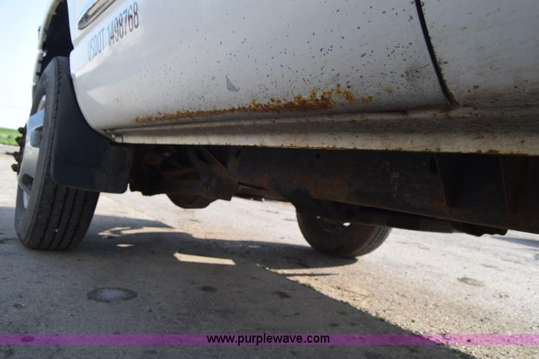 image for item L2579 2004 Dodge Ram 3500 Quad Cab flatbed pickup truck