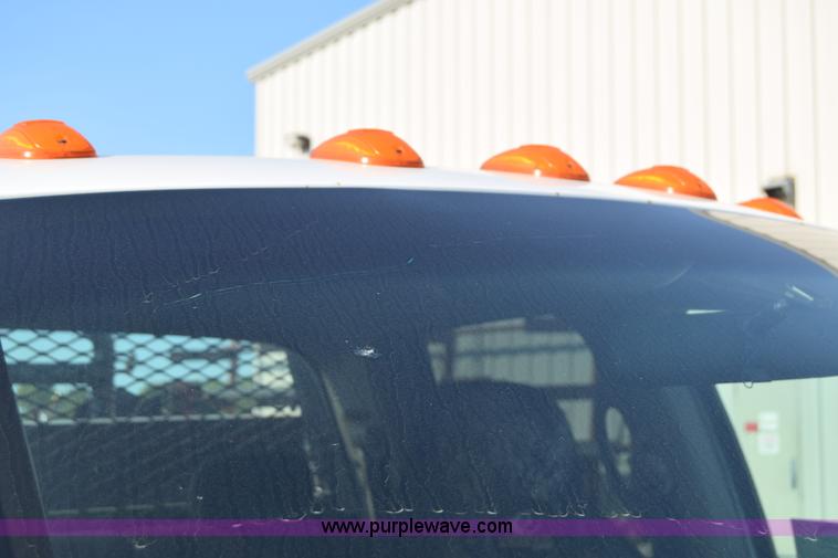 image for item L2579 2004 Dodge Ram 3500 Quad Cab flatbed pickup truck