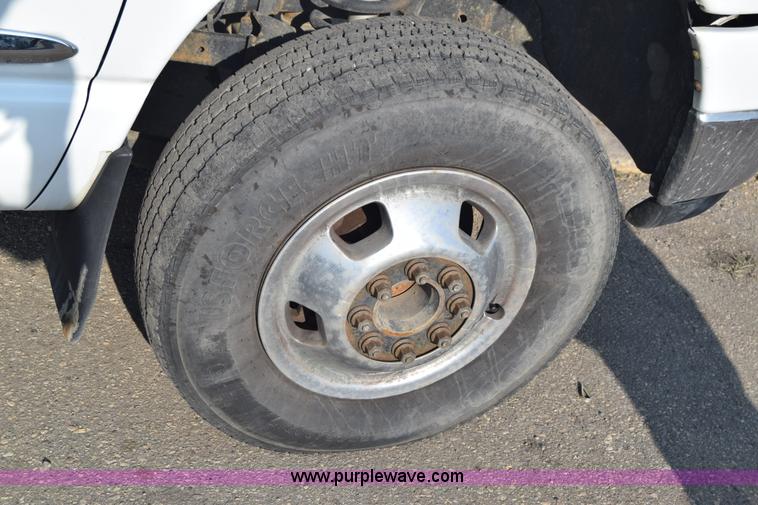 image for item L2579 2004 Dodge Ram 3500 Quad Cab flatbed pickup truck