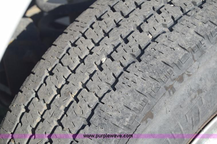 image for item L2579 2004 Dodge Ram 3500 Quad Cab flatbed pickup truck