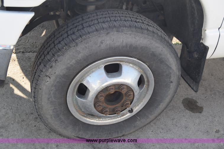 image for item L2579 2004 Dodge Ram 3500 Quad Cab flatbed pickup truck