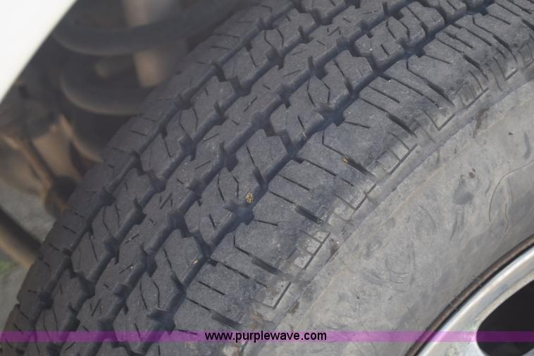 image for item L2579 2004 Dodge Ram 3500 Quad Cab flatbed pickup truck