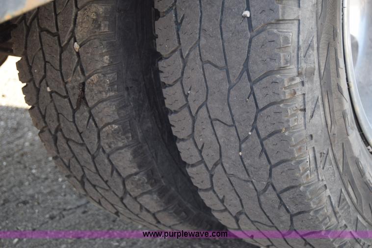 image for item L2579 2004 Dodge Ram 3500 Quad Cab flatbed pickup truck