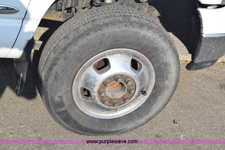 image for item L2579 2004 Dodge Ram 3500 Quad Cab flatbed pickup truck