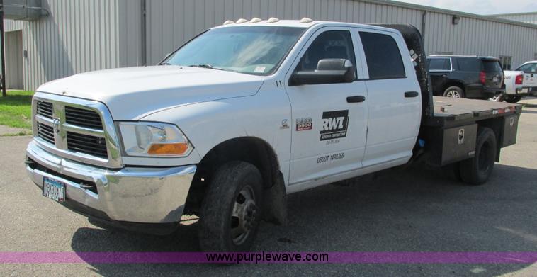 image for item L2631 2011 Dodge Ram 3500 Crew Cab flatbed pickup truck