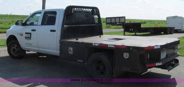 image for item L2631 2011 Dodge Ram 3500 Crew Cab flatbed pickup truck