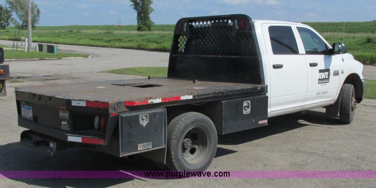 image for item L2631 2011 Dodge Ram 3500 Crew Cab flatbed pickup truck