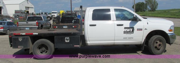 image for item L2631 2011 Dodge Ram 3500 Crew Cab flatbed pickup truck