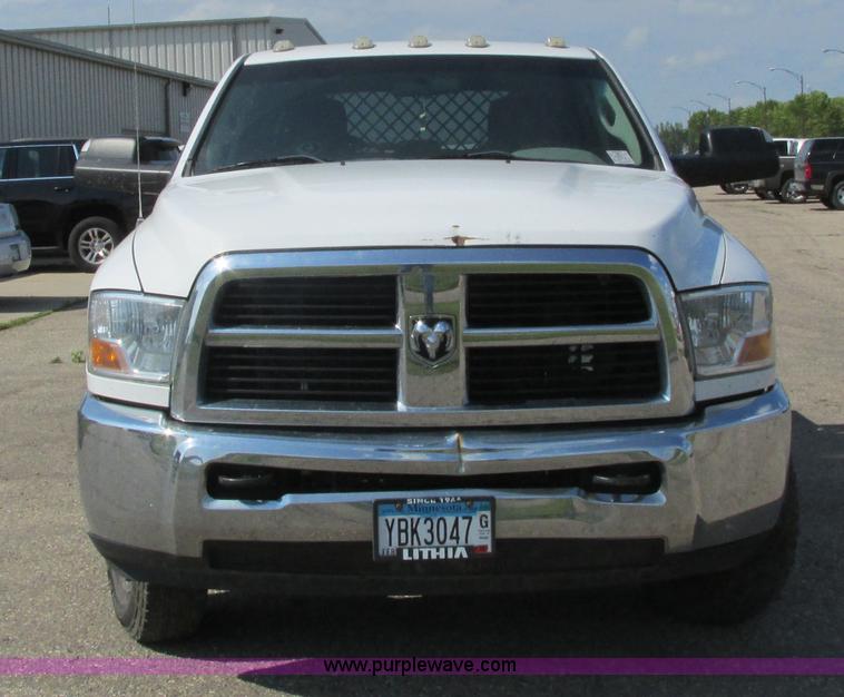 image for item L2631 2011 Dodge Ram 3500 Crew Cab flatbed pickup truck