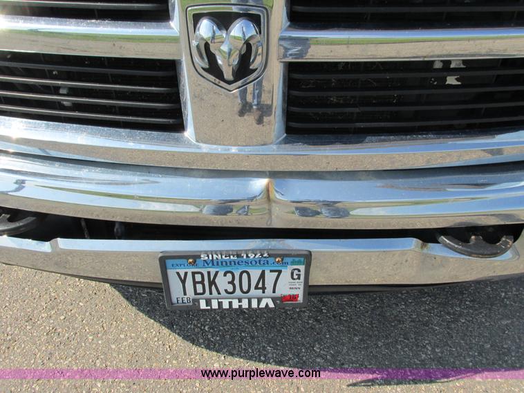 image for item L2631 2011 Dodge Ram 3500 Crew Cab flatbed pickup truck