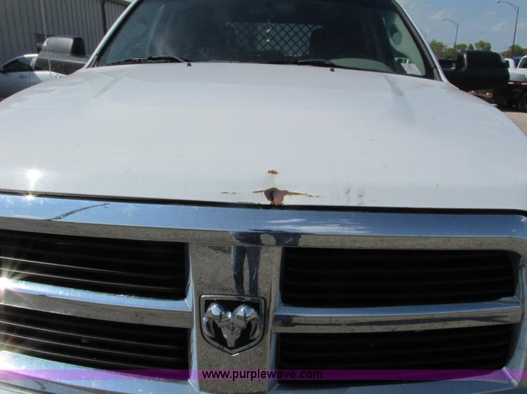 image for item L2631 2011 Dodge Ram 3500 Crew Cab flatbed pickup truck