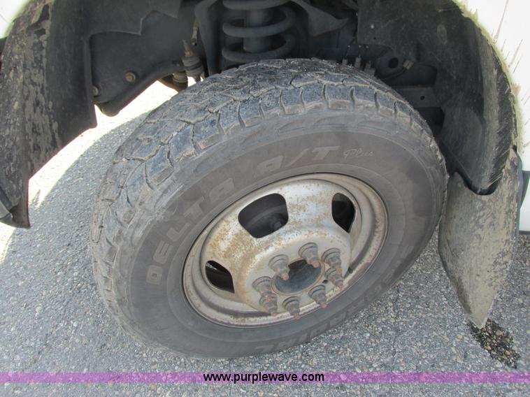 image for item L2631 2011 Dodge Ram 3500 Crew Cab flatbed pickup truck