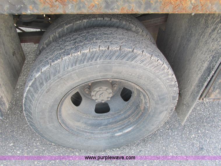 image for item L2631 2011 Dodge Ram 3500 Crew Cab flatbed pickup truck