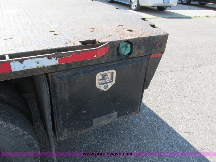 image for item L2631 2011 Dodge Ram 3500 Crew Cab flatbed pickup truck