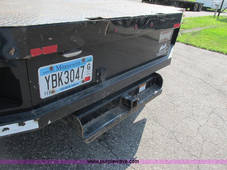 image for item L2631 2011 Dodge Ram 3500 Crew Cab flatbed pickup truck