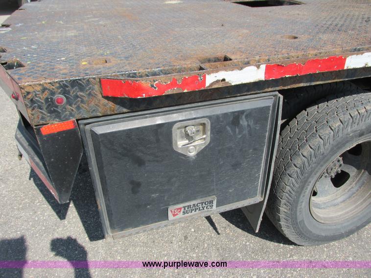 image for item L2631 2011 Dodge Ram 3500 Crew Cab flatbed pickup truck