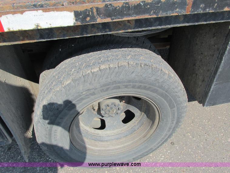 image for item L2631 2011 Dodge Ram 3500 Crew Cab flatbed pickup truck