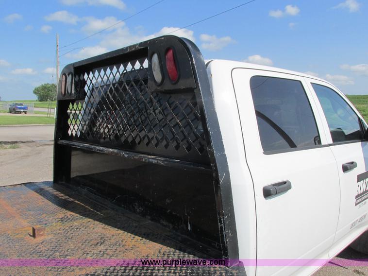 image for item L2631 2011 Dodge Ram 3500 Crew Cab flatbed pickup truck