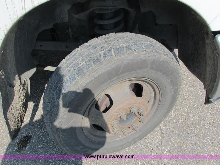 image for item L2631 2011 Dodge Ram 3500 Crew Cab flatbed pickup truck