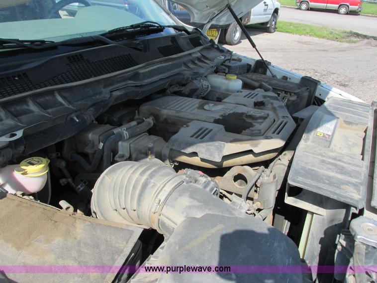 image for item L2631 2011 Dodge Ram 3500 Crew Cab flatbed pickup truck