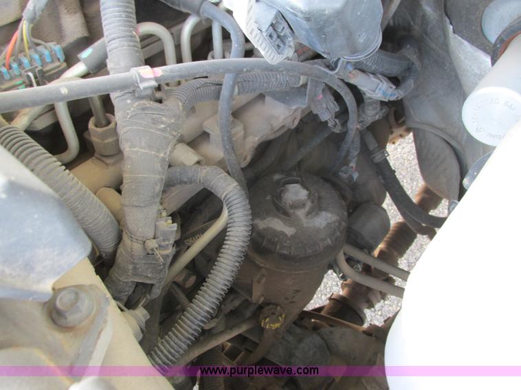 image for item L2631 2011 Dodge Ram 3500 Crew Cab flatbed pickup truck