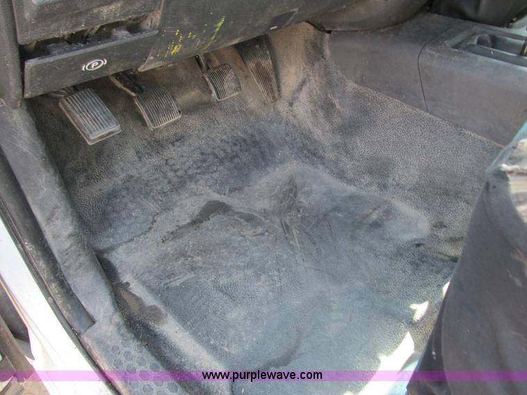 image for item L2631 2011 Dodge Ram 3500 Crew Cab flatbed pickup truck