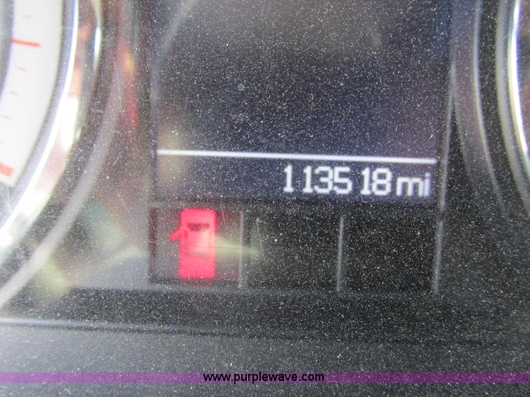 image for item L2631 2011 Dodge Ram 3500 Crew Cab flatbed pickup truck