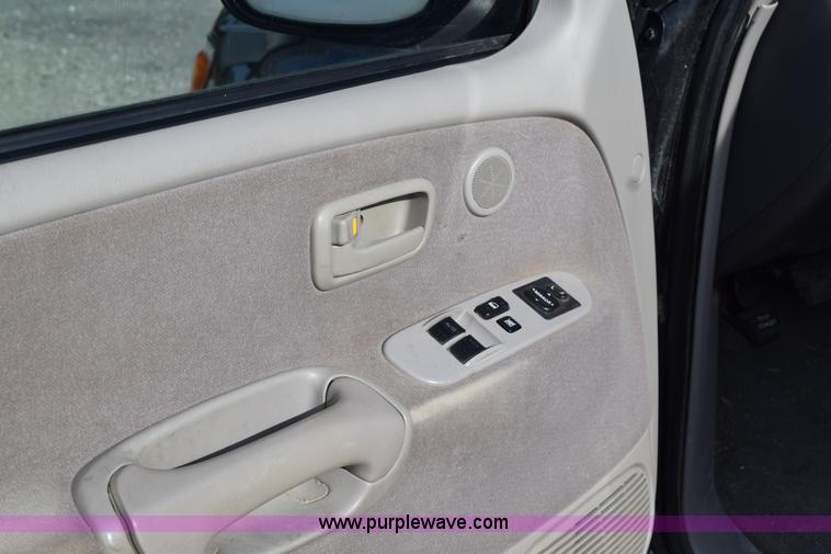 image for item H5119 2003 Toyota Tundra SR5 Access Cab flatbed pickup truck