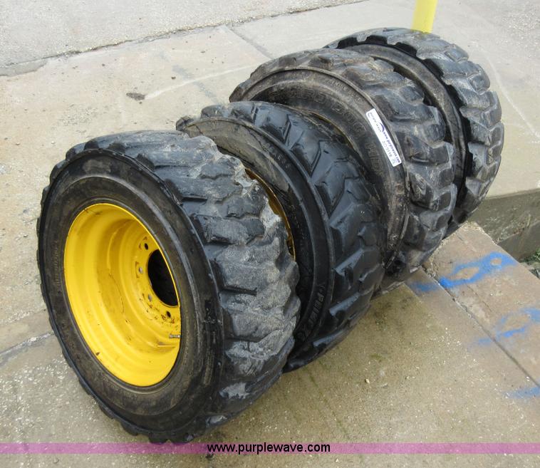 image for item AO9118 (4) John Deere skid steer tires and wheels